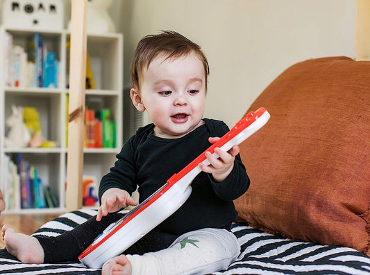 HAPE Baby Einstein ukulele 43 cm legno, plastica